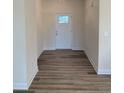 Welcoming entryway with wood-look floors and a white front door at 161 Jones Creek Ln, Lillington, NC 27546