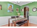 Stylish dining room with green walls, white trim, and a marble-topped table ready for entertaining at 178 Tun Tavern Dr, Cameron, NC 28326