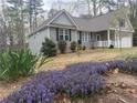 Inviting home with flowering garden, manicured yard and charming curb appeal on a treed lot at 1504 Kentucky Ave, Sanford, NC 27332