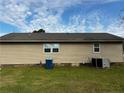 Side view of the home featuring vinyl siding, and well-maintained landscaping, providing privacy and curb appeal at 107 Mars Dr, Dunn, NC 28334