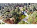 Aerial view of a home nestled among lush, mature trees at 172 Green Links Dr, Cameron, NC 28326
