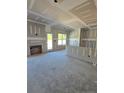 Spacious living room showing drywall application, fireplace alcove, and potential for customization at 45 Blackgum Ct, Spring Lake, NC 28390