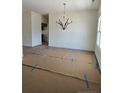 Dining room with contemporary chandelier and hardwood floors, awaiting your personal touch at 55 Blackgum Ct, Spring Lake, NC 28390