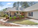 Beautiful home with a covered porch, manicured landscaping, and inviting curb appeal at 76 Silver Lake Pt, Sanford, NC 27332