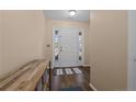 Inviting entryway with a white front door, wood-look flooring, and natural light at 91 Bicentennial Way, Cameron, NC 28326