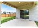 Covered patio with sliding glass doors, perfect for enjoying the outdoors in any weather at 10 N Dakota Ct, Spring Lake, NC 28390