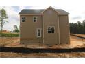 Rear view of a neutral sided home with a simple back porch and large windows for ample light at 106 Driftwood Ct, Sanford, NC 27330