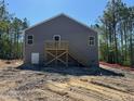 New construction with gray siding, back deck, and large backyard at 182 Horse Trot Ln, Sanford, NC 27332