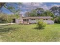 Ranch style home with a stone facade and inviting front yard at 107 Pandora Cir, Erwin, NC 28339