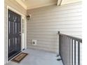 A welcoming front door with a 'Welcome' mat, offering a glimpse of cozy home ambiance at 124 Gallery Dr # 302, Spring Lake, NC 28390