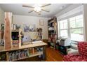 Comfortable home office with a window providing natural light and wood floors at 126 Islay Dr, Cameron, NC 28326