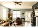 Cozy living room with hardwood floors, comfortable seating, and ample natural light at 186 Kentucky Derby Ln, Lillington, NC 27546