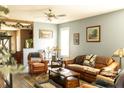 Inviting living room features comfortable leather furniture, neutral paint, and hardwood floors at 186 Kentucky Derby Ln, Lillington, NC 27546