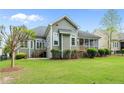 Backyard view of a stylish home featuring an outdoor space at 30 Spring Pond Ln, Spring Lake, NC 28390