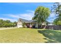 Quaint home with a lush green lawn and mature trees, offering a serene and inviting curb appeal at 45 Ridgecrest Rd, Cameron, NC 28326