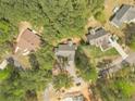 An aerial view of a home nestled among lush trees in a peaceful, established neighborhood at 6138 St Andrews Dr, Sanford, NC 27332