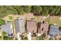 Aerial view of homes with lush trees, well-manicured lawns, and multiple car driveways at 758 Micahs N Way, Spring Lake, NC 28390