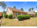 Exterior view of a cozy house with a fenced yard and lush greenery, offering a private retreat at 758 Micahs N Way, Spring Lake, NC 28390