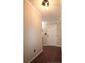 Inviting entryway featuring a stylish light fixture and wood-look flooring at 223 Angel Oak Dr, Bunnlevel, NC 28323