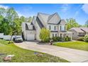 Beautiful two-story home with an attached two-car garage and a well-manicured front yard at 439 Colonist Pl, Cameron, NC 28326