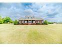 Spacious brick home with a large front yard, combining classic design with a touch of rural charm at 2021 Rice Rd, Sanford, NC 27330