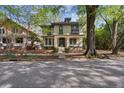 Charming two-story home with inviting front porch, dormer, mature tree, and well-maintained landscaping at 116 Hawthorne Rd, Raleigh, NC 27605