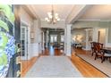 Inviting foyer with hardwood floors, elegant lighting, and an open view to the living spaces at 4114 Chancellors Ridge Way, Sanford, NC 27330