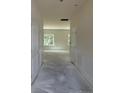 Bright hallway with white trim, doors and windows, offering a glimpse into the future living space at 136 Baneberry Pl, Broadway, NC 27505