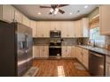 Well-lit kitchen featuring stainless steel appliances, granite countertops, and ample cabinet space at 199 Courtney Ln, Dunn, NC 28334