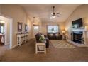 Cozy living room with plush seating, a fireplace, and neutral decor at 199 Courtney Ln, Dunn, NC 28334