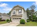 Beautiful two-story home featuring a well-maintained lawn and neutral siding at 852 Micahs N Way, Spring Lake, NC 28390