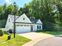 Well-maintained single-Gathering home featuring a stone-accented facade and a spacious two-car garage at 121 Camille Brooks Dr, Angier, NC 27501