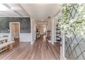 Elegant entryway with hardwood floors, decorative wainscoting, and a view into the home's interior at 152 Education Dr, Spring Lake, NC 28390