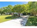 Long driveway leading to a home with lush trees, yard, and established landscaping at 186 Stone Cross Dr, Spring Lake, NC 28390