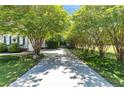 Extended driveway approach to this lovely home, framed with mature landscaping and trees at 186 Stone Cross Dr, Spring Lake, NC 28390
