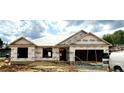 Exterior view of a new home under construction, showing framing and weatherproofing at 21 Shoreline Dr, Lillington, NC 27546