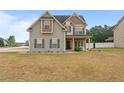 Charming two-story home with manicured lawn and welcoming front porch at 432 Century Dr, Cameron, NC 28326