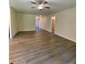 Spacious living room featuring hardwood floors and views of front entry at 78 Falls Of The Cape Dr, Lillington, NC 27546