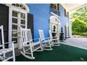 Spacious front porch with classic rocking chairs, offering a cozy and welcoming entrance at 236 E Andrews Ave, Henderson, NC 27536
