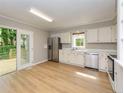 Spacious kitchen with stainless steel appliances and plenty of counter space, ideal for culinary adventures at 4916 Royal Adelaide Way, Raleigh, NC 27604