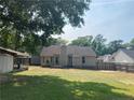 View of a large, grassy backyard with a privacy fence, perfect for outdoor activities at 109 Rock Harbor Ln, Spring Lake, NC 28390