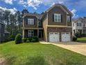 Beautiful two-story home with well-maintained lawn and landscaping at 109 Valley Brook Ln, Spring Lake, NC 28390