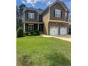Attractive home showcasing a green lawn and inviting curb appeal at 109 Valley Brook Ln, Spring Lake, NC 28390