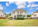 Expansive backyard featuring a lush lawn, patio, and privacy fence, perfect for outdoor enjoyment at 112 Saw Grass Ct, Bunnlevel, NC 28323