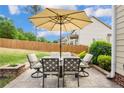 Inviting outdoor patio with comfortable seating and shade, ideal for relaxing and entertaining at 112 Saw Grass Ct, Bunnlevel, NC 28323