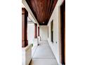 Inviting porch with stained wood ceiling, brick columns, and concrete floor at 134 Zion Church Rd, Sanford, NC 27332