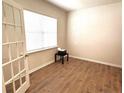 Well-lit office space with wood-look flooring, offering a modern and functional workspace at 158 David Hill Dr, Sanford, NC 27330