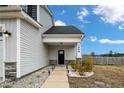 Welcoming front entrance with stone accents and well-maintained landscaping, offering a warm curb appeal at 1968 Josey Williams Road, Erwin, NC 28339