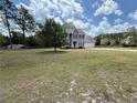 Traditional two-story home with large front yard and a mix of grass and bare spots at 23 Glenn Oak Dr, Sanford, NC 27330