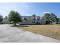 Inviting home with a charming exterior, well-manicured lawn and an asphalt driveway for a classic appeal at 390 Sandy Ridge Rd, Dunn, NC 28334